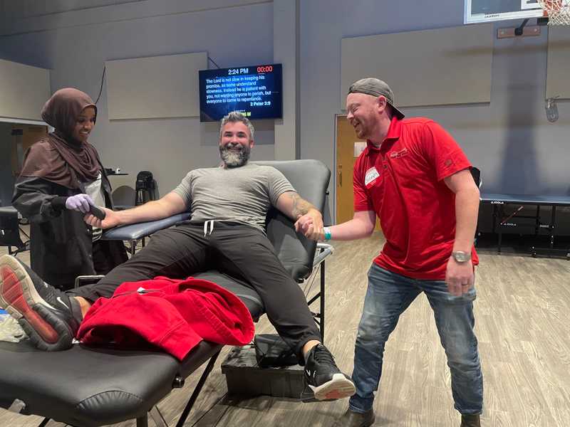 Joey and Zeke show support at the for each other and Roof Revivers at the 2025 Blood Drive.