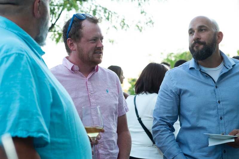 Reed and Joey of Roof Revivers at the 2025 CFF Sips & Wiggles event.